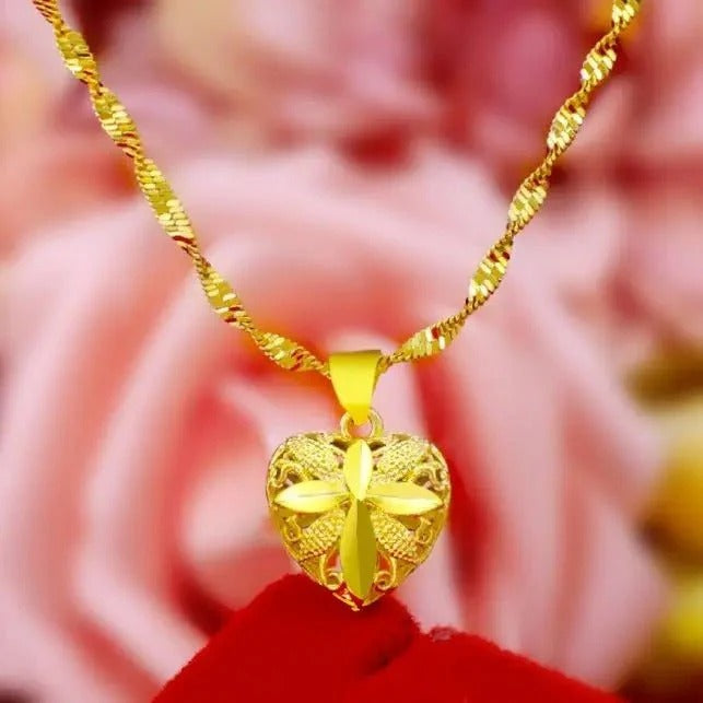 Memorial heart pendant with secure screw-top compartment