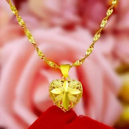 Memorial heart pendant with secure screw-top compartment